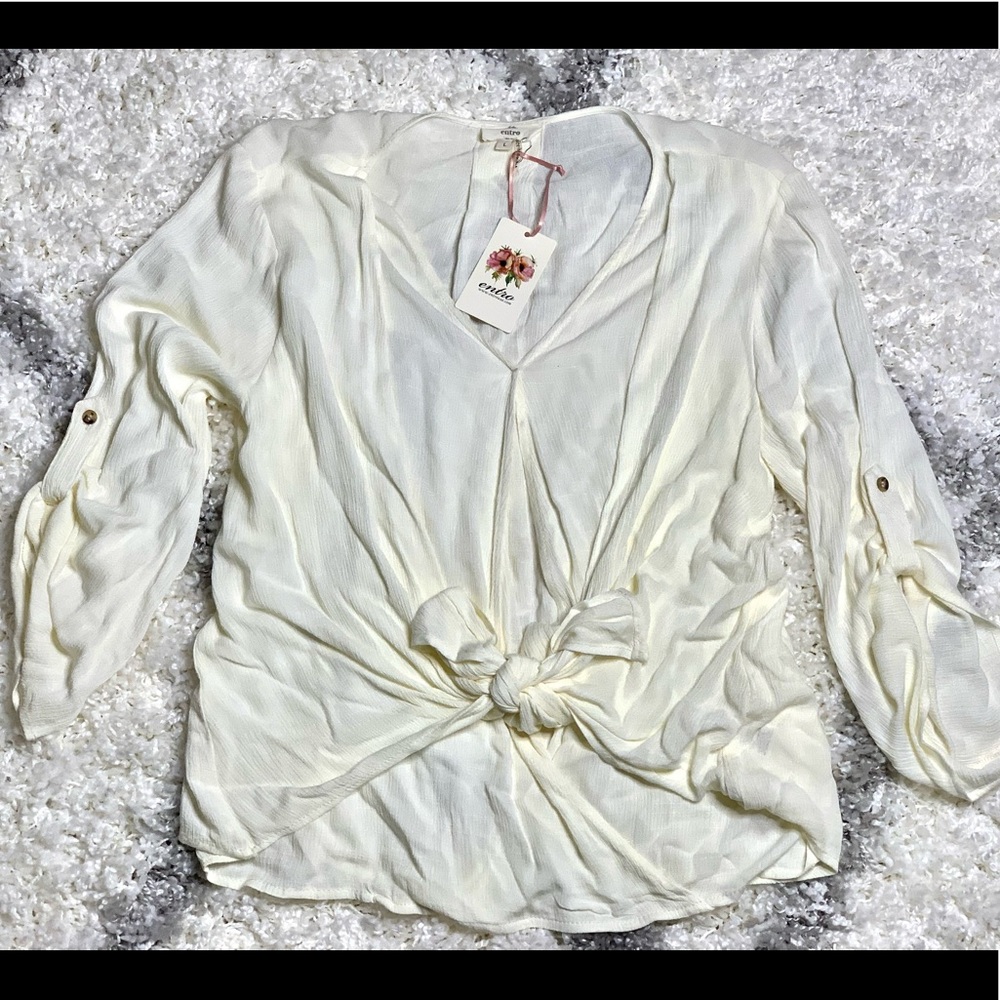 Cream color tie front shirt. Never worn, new with tags. Size L.